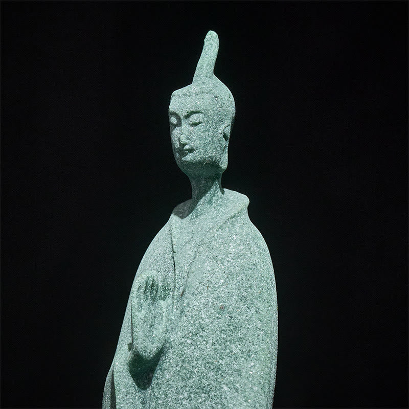 Sandstone Meditation Buddha Standing Statue – closeup of face showing detailed sandstone texture and serene expression, macro