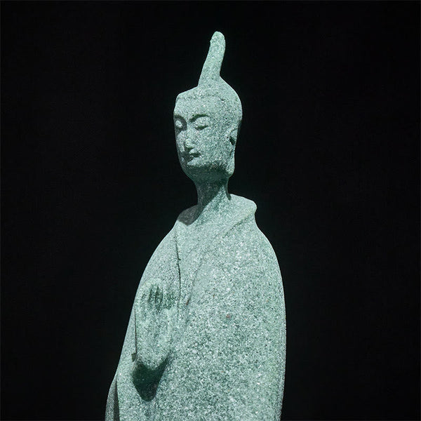 Sandstone Meditation Buddha Standing Statue – closeup of face showing detailed sandstone texture and serene expression, macro