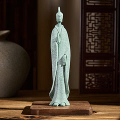 Sandstone Meditation Buddha Standing Statue – front view on wooden base with lattice screen backdrop, peaceful home decor