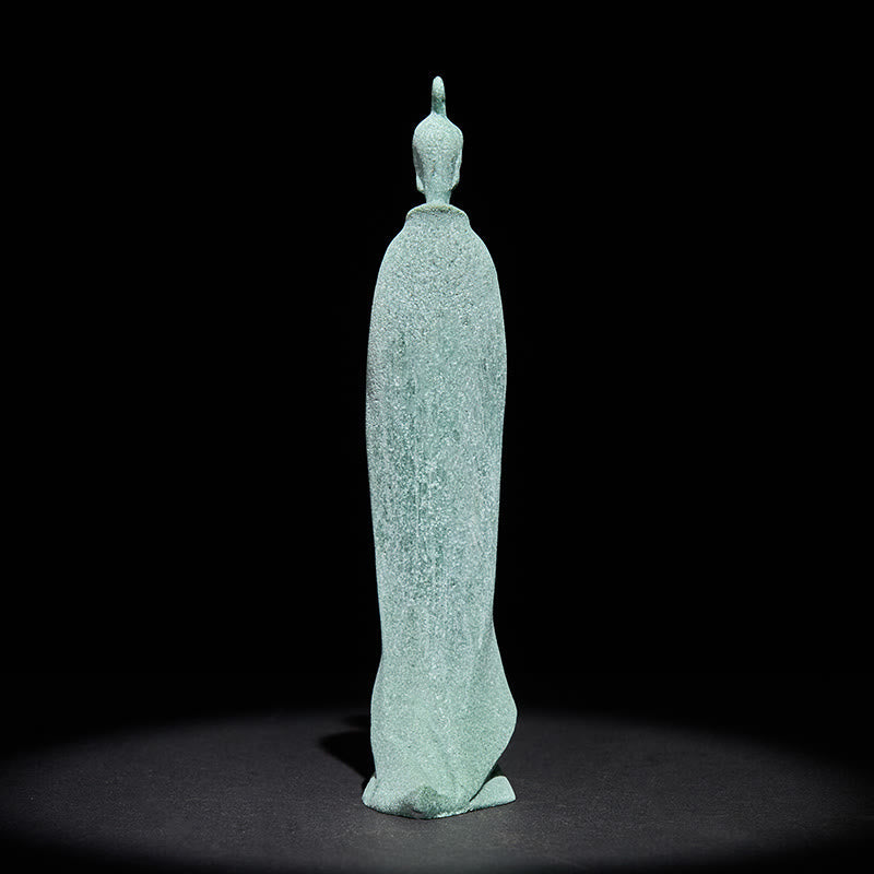 Sandstone Meditation Buddha Standing Statue – back view showing long flowing robe silhouette on dark background, elegant form