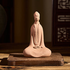 Ceramic Sitting Buddha Prayer Statue – On wooden stand in warm room with lattice screen, prayer altar