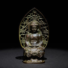 Tathagata Buddha Alloy Statue – Front view with ornate pierced halo on dark background, zen altar