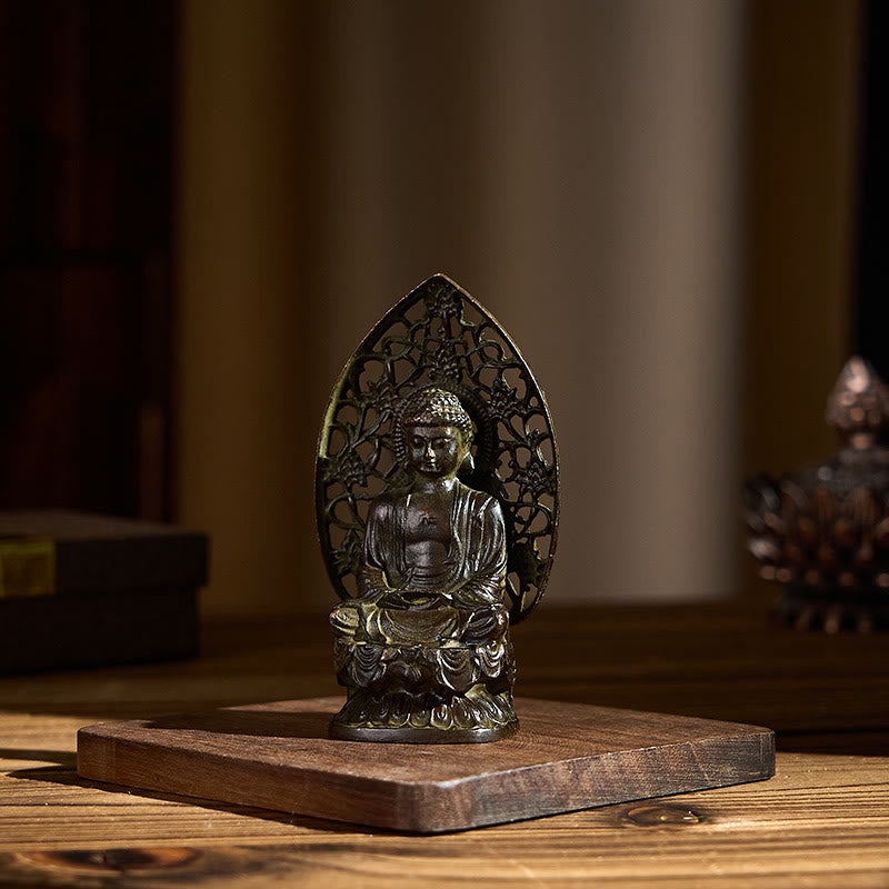 Tathagata Buddha Alloy Statue – Side-angled desk display with warm ambient lighting, calm gift