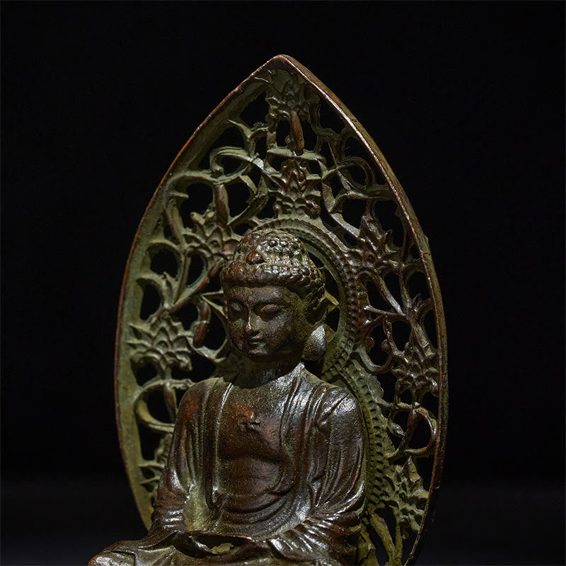 Tathagata Buddha Alloy Statue – Closeup of serene face and pierced halo detail, macro texture