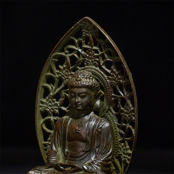 Tathagata Buddha Alloy Statue – Closeup of serene face and pierced halo detail, macro texture