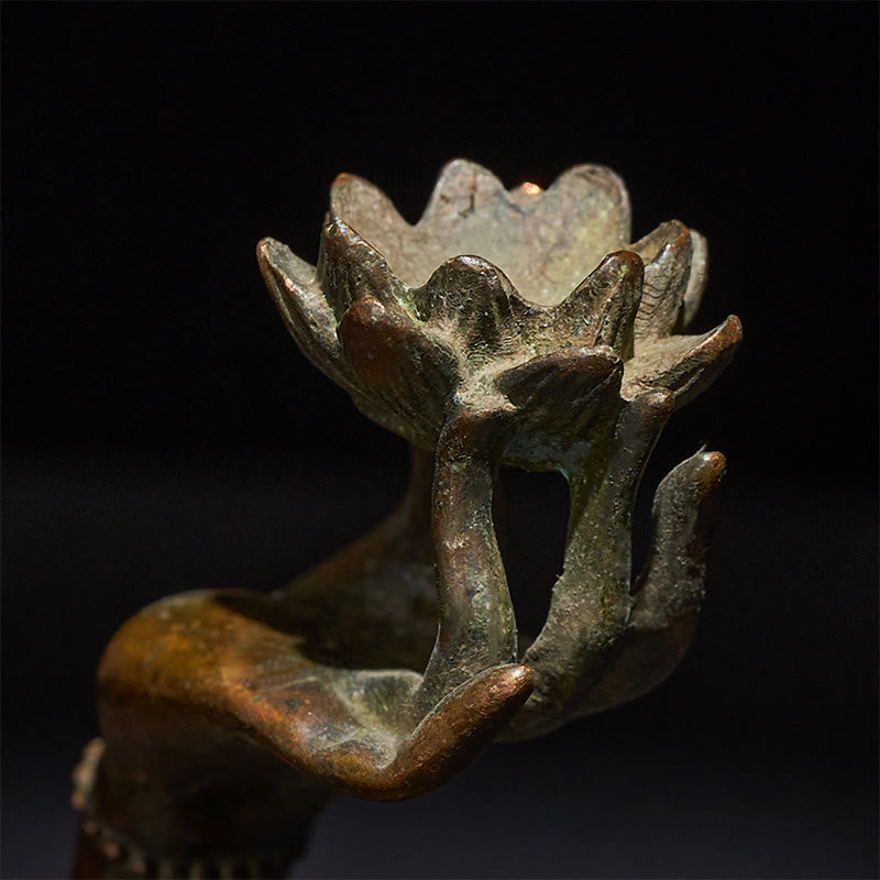 Buddha Hand Lotus Alloy Statue – Macro of lotus bloom cradled in palm, sacred symbol