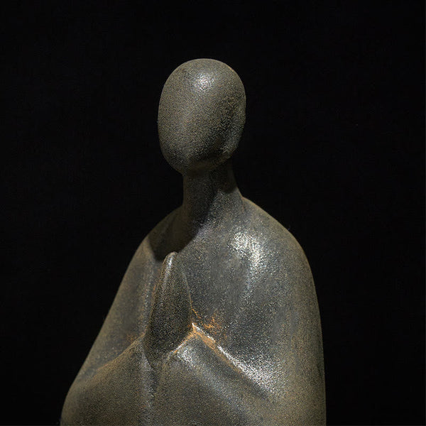 Iron Powder Formless Buddha Statue – closeup of head and upper body revealing iron powder texture, artistic detail