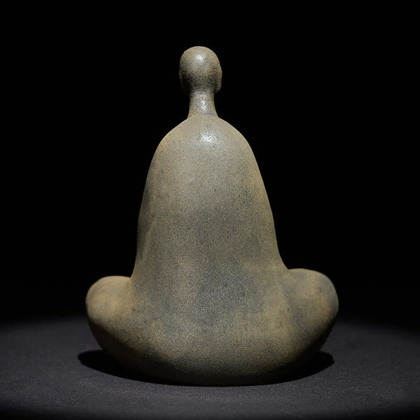 Iron Powder Formless Buddha Statue – back view showing smooth flowing robe contours on dark background, formless design