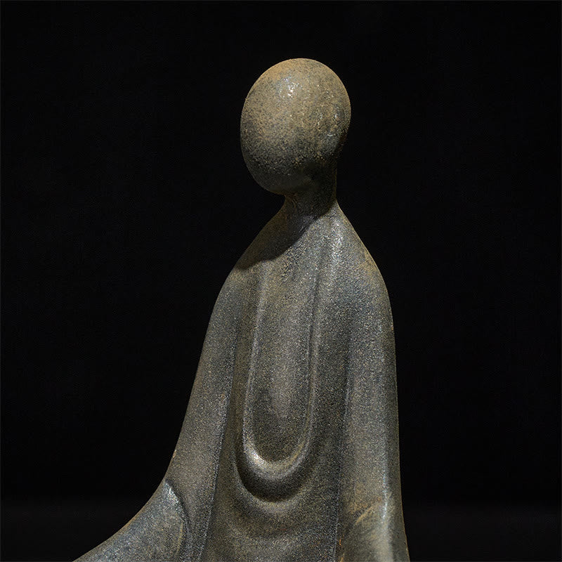 Iron Powder Sitting Formless Buddha Statue – closeup of iron grain and seated robe detail, macro