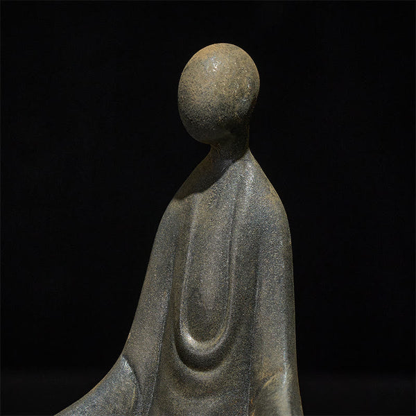 Iron Powder Sitting Formless Buddha Statue – closeup of iron grain and seated robe detail, macro