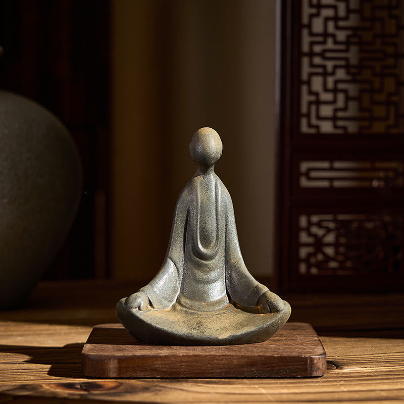 Iron Powder Sitting Formless Buddha Statue – front view on wood base, soft ambient glow, mindfulness