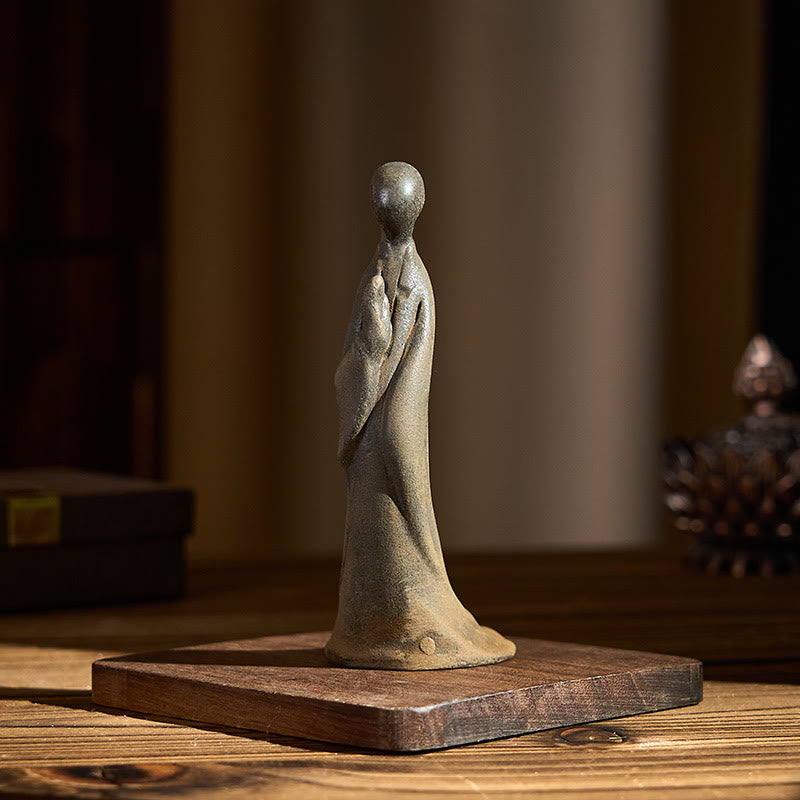 Iron Powder Formless Buddha Statue – right side view on wood base, ambient home setting, meditation