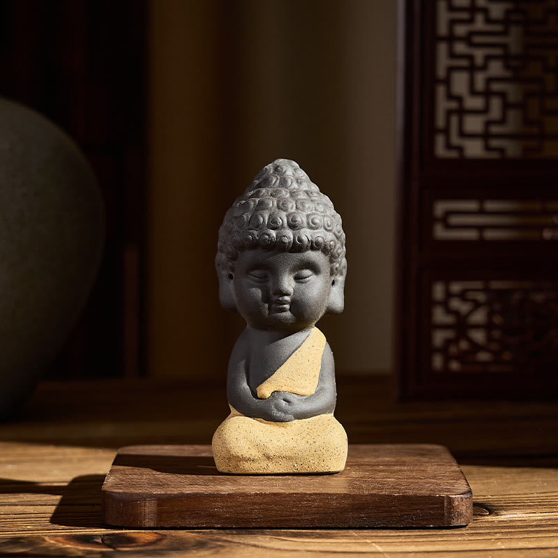 Tathagata Buddha Purple Clay Serenity Desk Decoration Statue – close-up of peaceful buddha face, detailed clay art statue