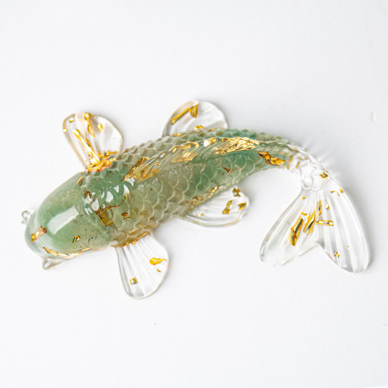 Koi Fish Crystal Chip Resin Decoration – translucent sage green glass koi fish with gold leaf and flowing fins on white