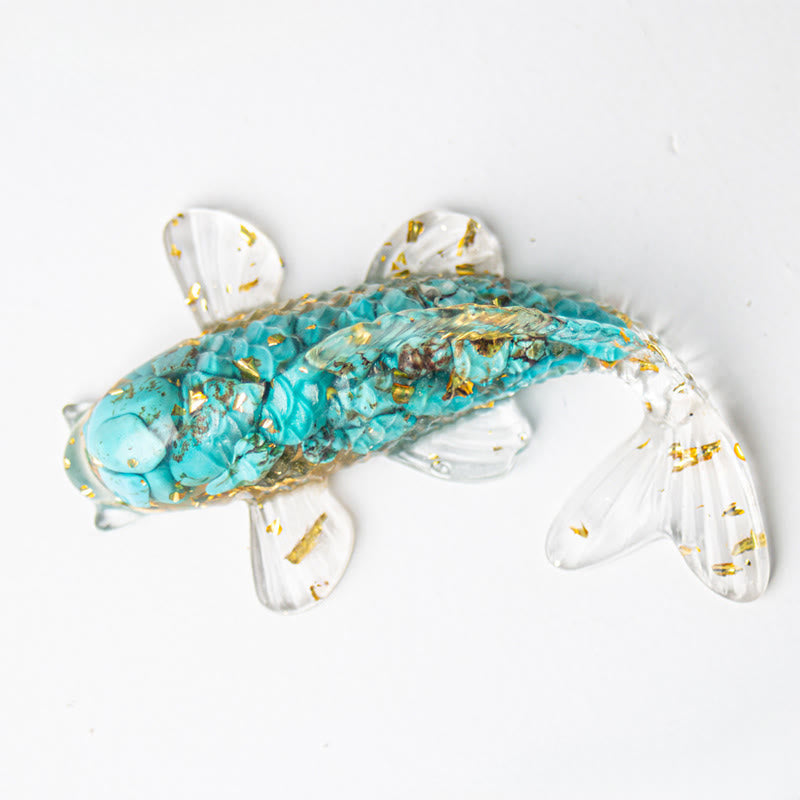Koi Fish Crystal Chip Resin Decoration – turquoise koi fish with crushed stone chips and gold leaf in resin on white