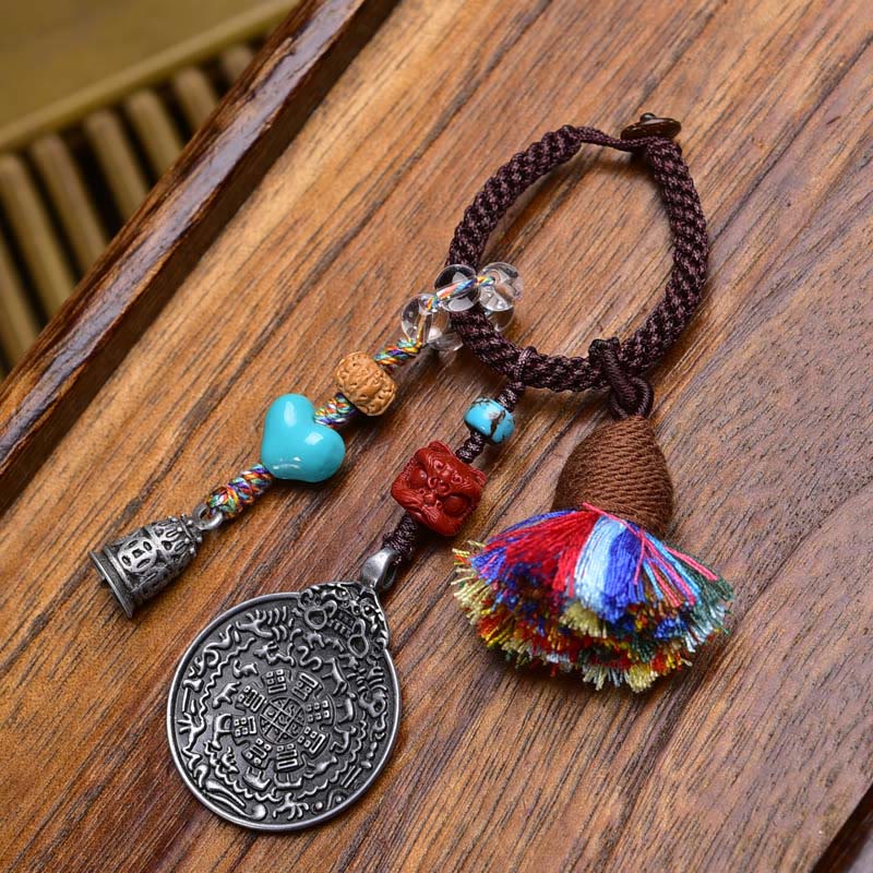 Chinese Zodiac Nine Palaces Dzi Bead Buddha Serenity Key Chain – dzi bead held in hand, natural agate stone keychain