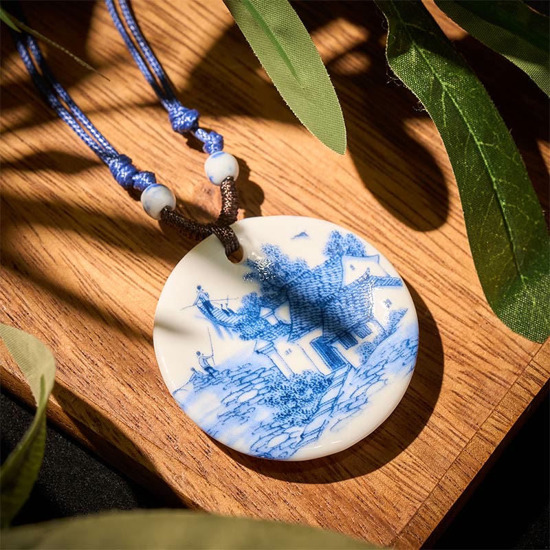 Ceramic Peony & Lotus Pendant – Pagoda and fishing figures on blue-white porcelain disc, landscape necklace