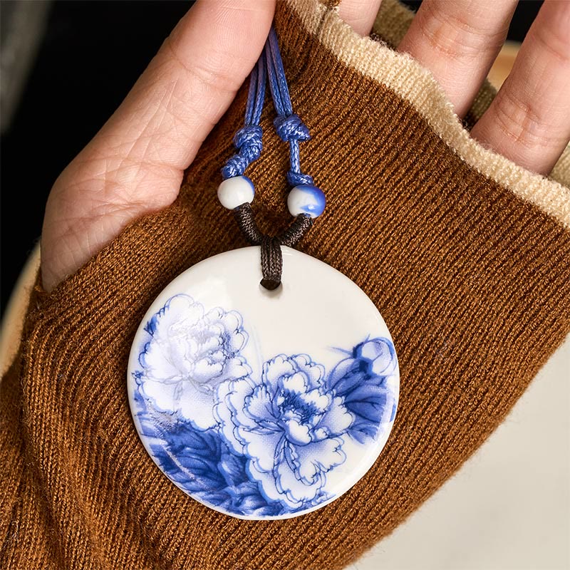 Ceramic Peony & Lotus Pendant – Peony design in palm on ribbed brown knit, Chinese knot necklace