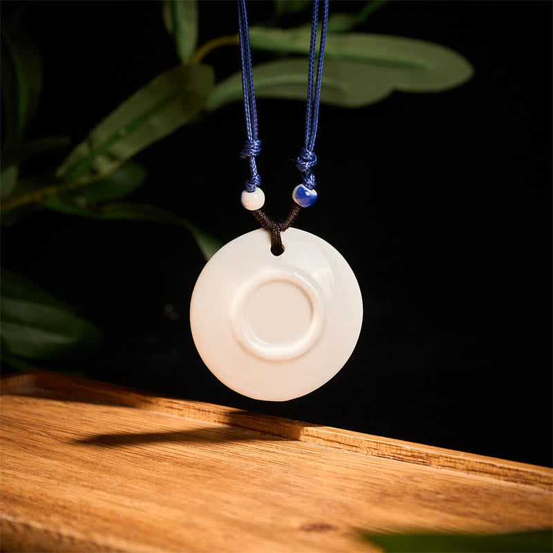 Ceramic Peony & Lotus Pendant – Concentric circle white pendant with blue cord and beads, ceramic jewelry
