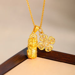 24K Gold Plated Pixiu Cross Dorje Vajra Necklace – pendant on dark wood corner, diamond accent detail