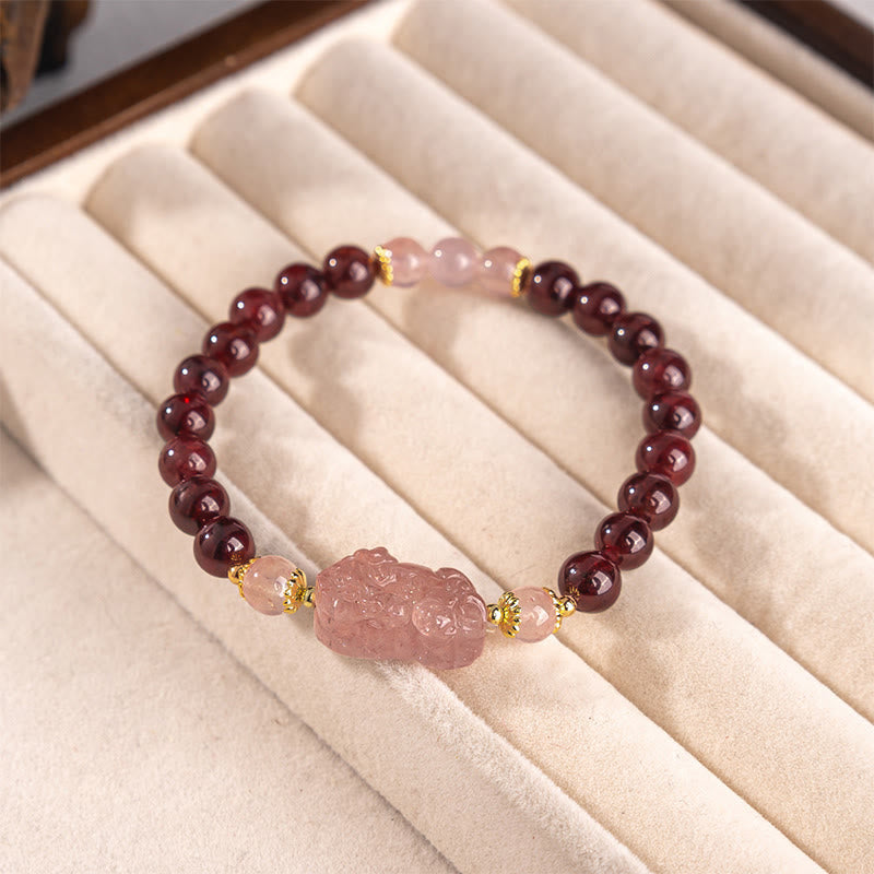 Garnet Strawberry Quartz Pixiu Bracelet – resting in cream velvet tray, luxury crystal bracelet
