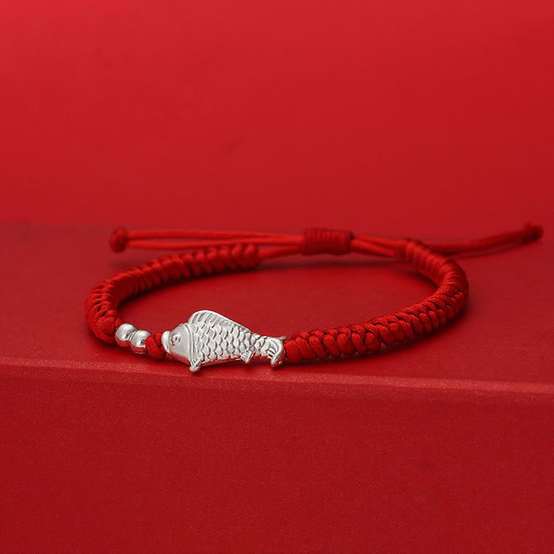 999 Silver Koi Fish Red String Bracelet – red braided cord with silver fish charm and spacer beads on red stepped platform