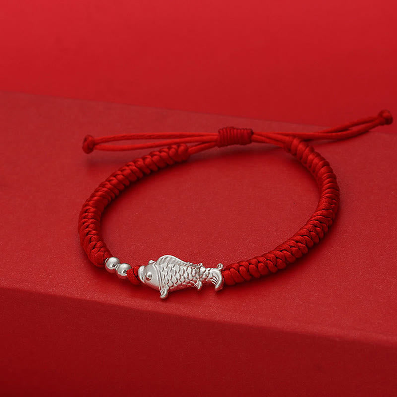 999 Silver Koi Fish Red String Bracelet – red braided cord with detailed silver koi charm, adjustable sliding knot closure