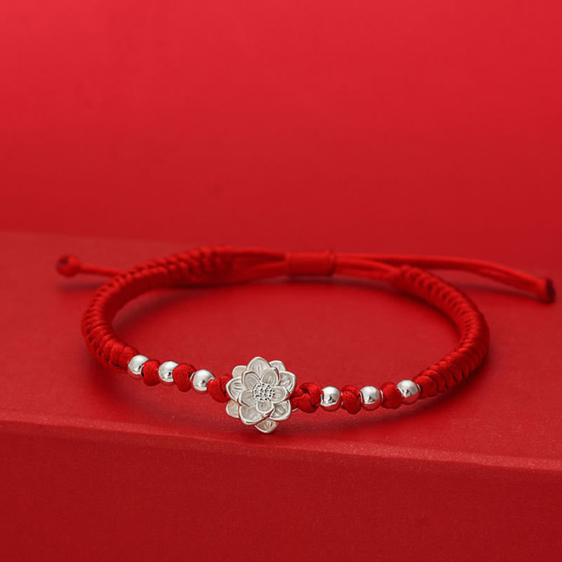 Sterling Silver Lotus Red String Luck Bracelet – silver lotus charm with symmetrical beads on woven red cord, spiritual