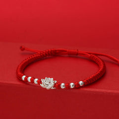 Sterling Silver Lotus Red String Luck Bracelet – three-quarter view showing layered lotus petals and silver beads, lucky