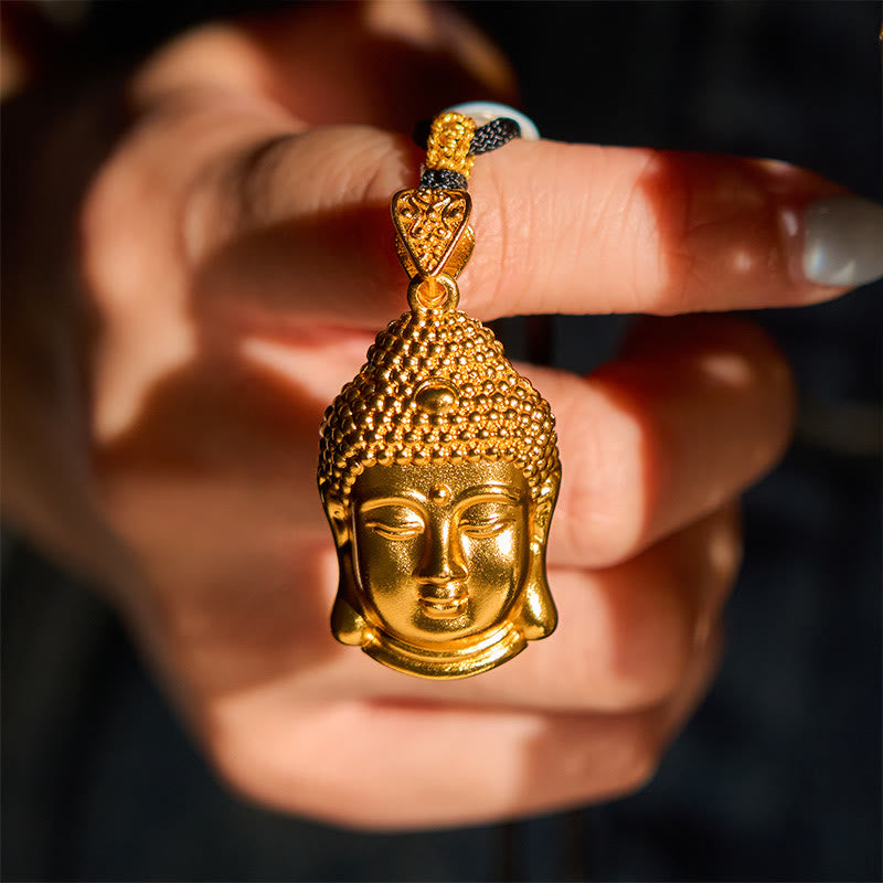 24K Gold Plated Brass Buddha Braided Cord Serenity Necklace – necklace laid on dark fabric, serenity buddha jewelry