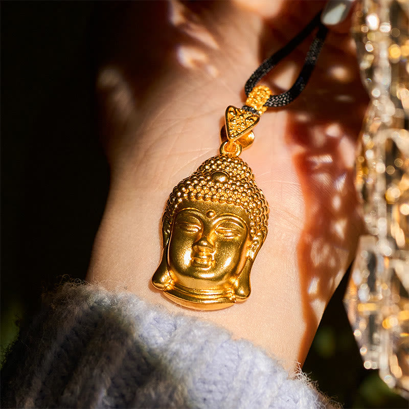 24K Gold Plated Brass Buddha Braided Cord Serenity Necklace – pendant with soft bokeh background, elegant gold jewelry