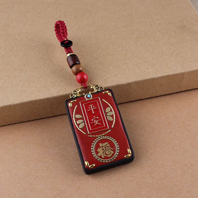 Ebony Koi Fish Fu Character Keychain – red lacquer Ping An and Fu pendant with gold calligraphy and beaded red cord close-up