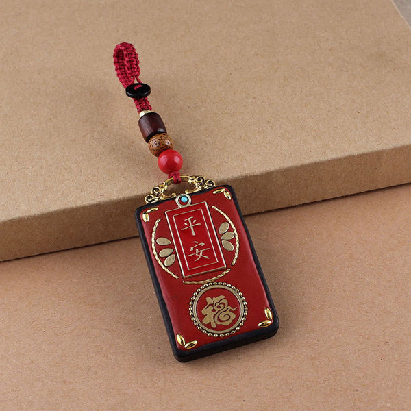 Ebony Koi Fish Fu Character Keychain – red lacquer Ping An and Fu pendant with gold calligraphy and beaded red cord close-up