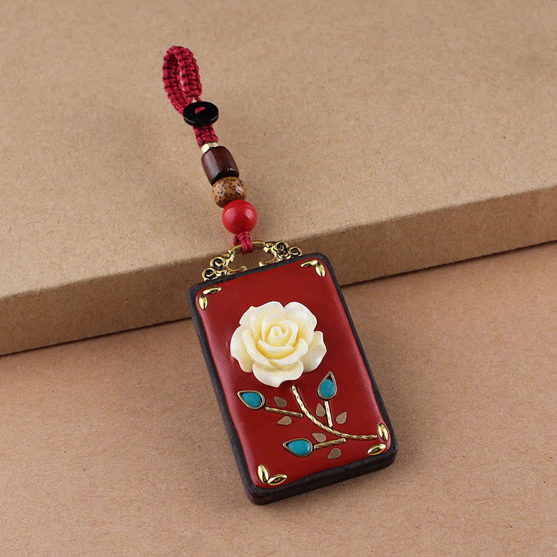 Ebony Koi Fish Fu Character Keychain – red lacquer rose pendant with gold stem, turquoise, and beaded red cord close-up