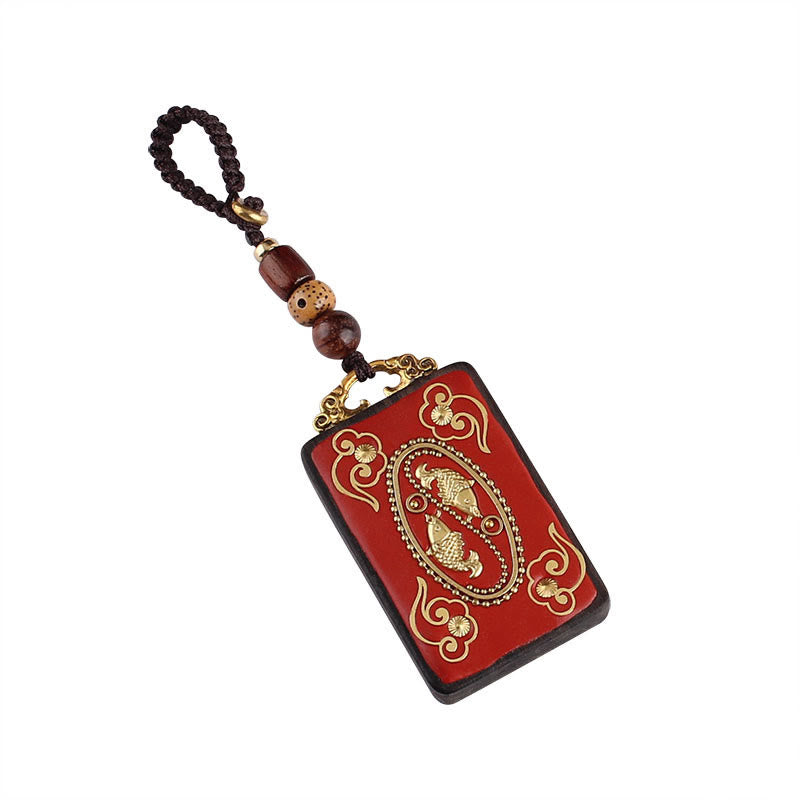 Ebony Koi Fish Fu Character Keychain – red cinnabar koi fish pendant with gold inlay on white background, feng shui charm