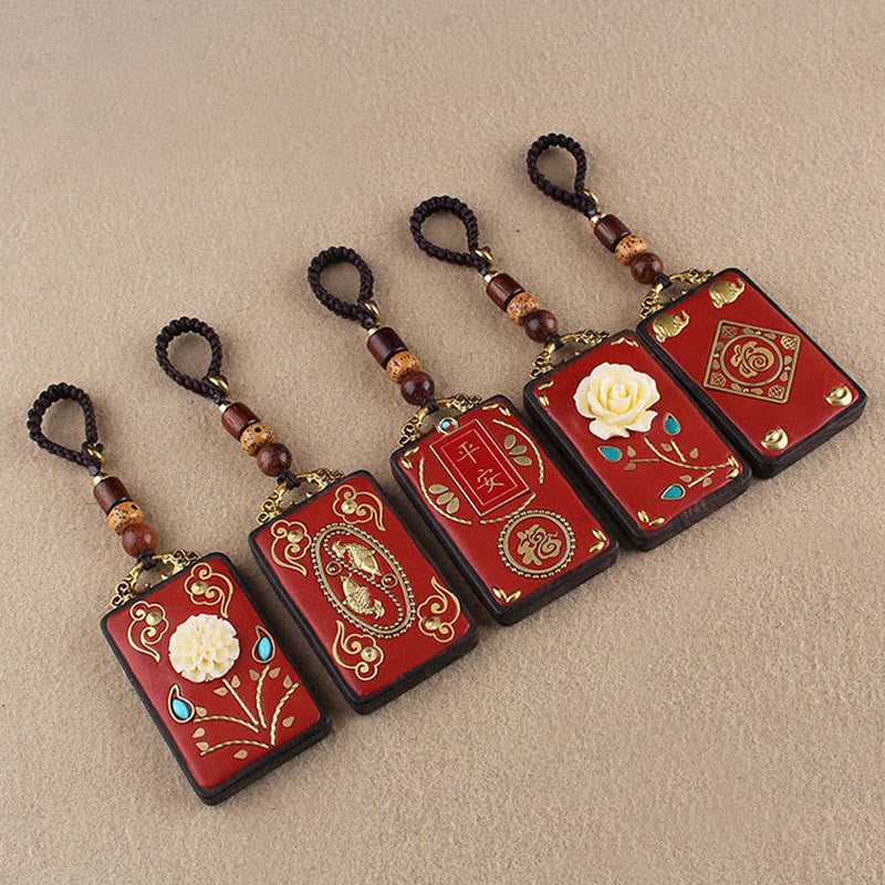 Ebony Koi Fish Fu Character Keychain – five red lacquer pendant keychains with koi, flowers, and fortune symbols diagonal row