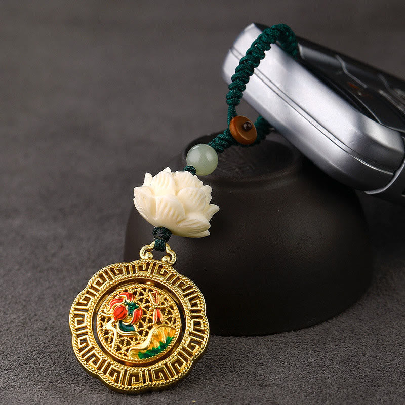 Bodhi Seed Lotus Jade Key Chain - Lotus keychain paired with car key fob on dark slate, automotive charm