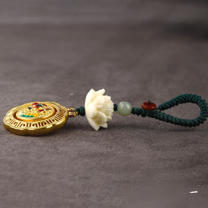Bodhi Seed Lotus Jade Key Chain - Low angle side view showing gold medallion, lotus, and jade bead details
