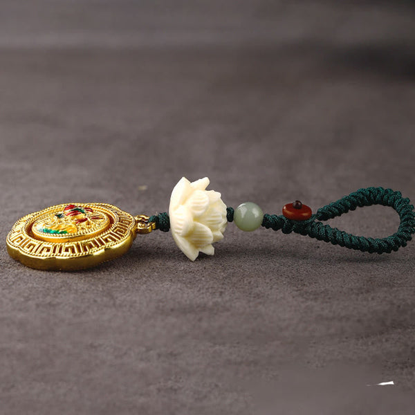 Bodhi Seed Lotus Jade Key Chain - Low angle side view showing gold medallion, lotus, and jade bead details