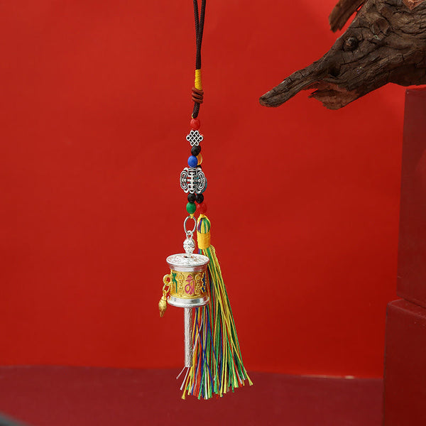 Tibetan Mani Wheel Ornament, gold and red enamel details, colorful bead strand