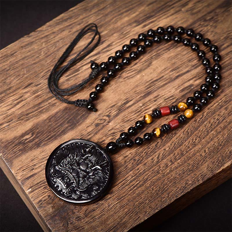 Black Obsidian Dragon Necklace - full strand with tiger eye and red bead accents on rustic wood, Transformation