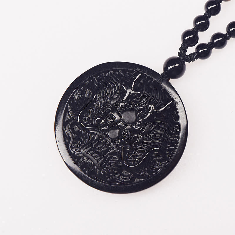 Black Obsidian Dragon Necklace - dragon relief carving on white background, beaded strand, Protection
