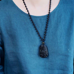 Ksitigarbha Buddha Black Obsidian Pendant Necklace – close-up face detail, compassionate buddha expression