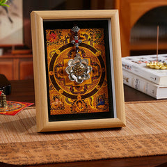 Lotus Golden Inlot Thangka Frame - Gold mandala with hanging lotus charm on oak frame, black mat border