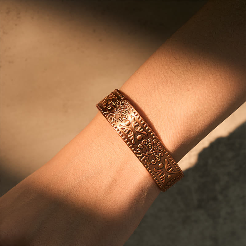 Tree of Life Copper Cuff Bracelet – worn on wrist in golden hour light, adjustable copper bangle