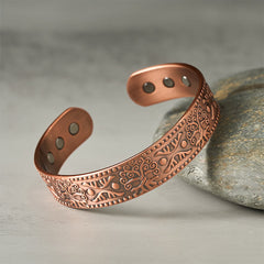 Tree of Life Copper Cuff Bracelet – side angle on stone showing dotted border detail, copper healing bracelet