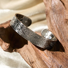 Tree of Life Copper Cuff Bracelet – warm light on driftwood showing embossed design, wellness jewelry