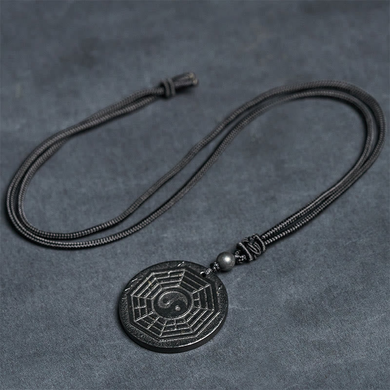 Shungite Stone Yin Yang Bagua Necklace - reverse side on wood, shungite talisman