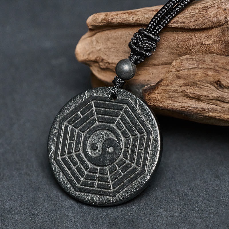 Shungite Stone Yin Yang Bagua Necklace - 45-degree detail shot, bagua talisman