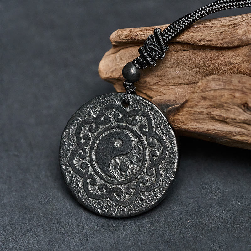 Shungite Yin Yang Pendant – styled on driftwood prop, EMF protection amulet